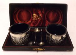 A cased pair of late Victorian Circular Salts, embossed with a continuous procession of classical