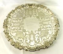 A Victorian Electroplated Salver, circular shaped with shell and scroll rim, shell and foliate