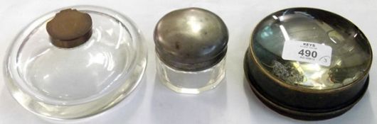 A large circular Glass Inkwell of compressed form; a further Table Top Magnifier and a base metal