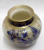 A small squat Doulton Burslem Vase decorated with blue and gilt sprays of irises on a cream