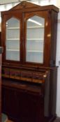 A Victorian Mahogany Cylinder Front Bureau Bookcase, the top section with two glazed doors to a