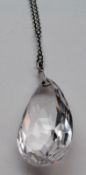 A Facetted Teardrop Shaped Crystal Necklace on metal chain