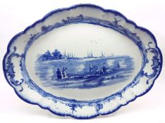A Doulton Burslem Double-Handled Shaped Oval Meat Plate, typically decorated in blue, 17 ½” long