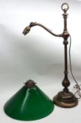An early 20th Century Electric Table Lamp with adjustable swing arm fitted with a green opaque glass