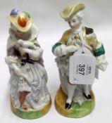 A pair of 20th Century Continental Figures, in period costume, decorated in colours with a lustre