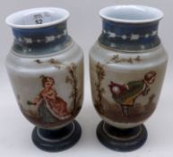 A pair of late 19th Century French Opaque Glass Pedestal Vases, decorated with painted detail of