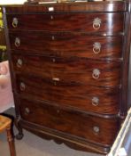 A 19th Century Mahogany Bow Fronted Chest of five graduated drawers, flanked on either side by