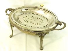A late Victorian partially Electroplated Bacon Dish, oval shaped to a four-footed base, engraved