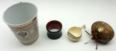 A Mixed Lot: an Enamelled Beaker, a small Lacquered Napkin Ring, a Papier-mâché Egg-shaped Trinket