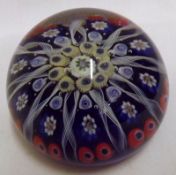 A 20th Century Paperweight with central rosette of coloured canes to radiating Latticinio strands on