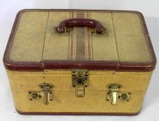 A mid-20th Century Small Travelling Vanity Case, with three-sectional lid, the central section lifts