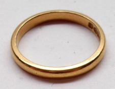 A mid-20th Century hallmarked 22ct Gold Wedding Ring, weighing approximately 2 ½ gm