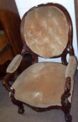 A Victorian Simulated Rosewood Framed Gents Armchair, with spoon back, slightly swept arms,
