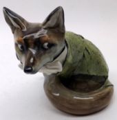 A Royal Doulton Model of a suited fox, decorated in colours, the base with impressed No 1027 and