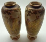 A pair of 20th Century Satsuma Baluster Vases of tapering form, well-gilded and painted in colours
