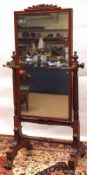 A 19th Century Mahogany Cheval Mirror, with central fan moulded mirror panel supported on either