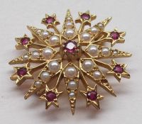 A hallmarked 9ct Gold Starburst design Brooch/Pendant, the points set with Seed Pearls