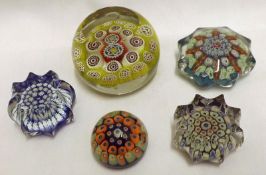 A group of four assorted 20th Century Millefiori type Paperweights, decorated in various colours