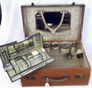 A Gents Tan Leather Vanity Case fitted with an assortment of bottles and jars with chromium/silver