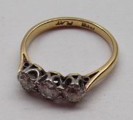 An 18ct Gold and Platinum three stone old cut Diamond Ring, approximately .6ct total, stamped “18ct”