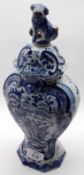 A Delft Covered Baluster Vase of ovoid form, typically decorated in underglaze blue with scenes