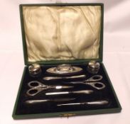 A George V Silver Moulted Manicure Set with wreath embossed detail, complete with nine pieces,