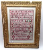 A 19th Century Sampler, wool stitched on gauze, alphabet in capitals and italics and numerals, by