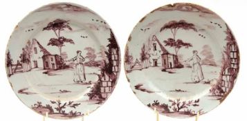 A pair of 18th Century 9” Delft Plates, decorated with rural scenes of a young lady before a