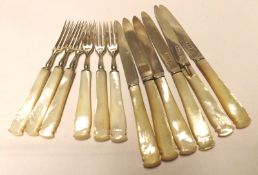 Six pairs of George V Fruit Knives and Forks with plain blades and carved Mother-of-Pearl