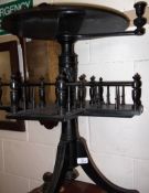 A late 19th Century Ebonised Reading Table of circular pedestal form with moulded edge, over a
