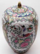 A 20th Century Chinese Large Covered Jar, decorated predominantly in famille rose with exotic