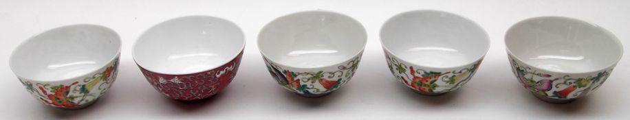 A set of four Oriental Circular Rice Bowls, decorated in colours with butterflies and foliage;