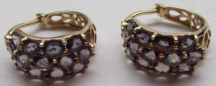A pair of hallmarked 9ct Gold all Amethyst set Crescent Earrings