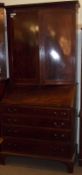 A 19th Century Mahogany Bureau Bookcase Cabinet, the top section with two panelled doors to an
