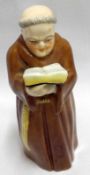 A Royal Worcester Candle Snuffer formed as a monk in brown habit, 4 ½” high