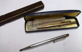 A boxed white metal Propelling Pencil, stamped “Made in England” and “Sterling Silver”, (