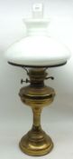 An early 20th Century Oil Lamp, clear glass chimney, opaque glass shade, brass fittings, font and