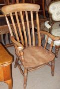 A Beech Windsor style Kitchen Chair with bar and slat back, scrolled arms, solid seat, splayed