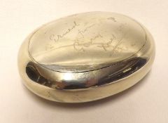 A late Victorian Pebble Formed Tobacco Box with “Squeeze” opening action (defective), the lid