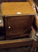 An early 20th Century Oak Bedside Cabinet, of plain rectangular form, top with moulded edge over a