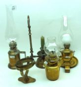 A Mixed Group of three small brass based Portable Oil Lamp with glass shades, and a further Wall
