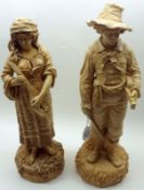 A pair of Robinson & Leadbetter Figures of a musical couple, decorated in a plain beige finish,