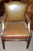 A Leather upholstered Gainsborough style Mahogany framed Armchair, plain apron and moulded supports,