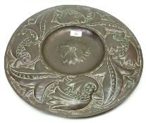 An Arts & Crafts type Copper Wall Charger, decorated with embossed detail of flowers, 17” wide,