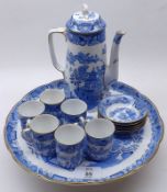 A Royal Worcester Blue Willow pattern Coffee Pot, six matching small Coffee Cans and Saucers and a