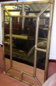 A Gilt Framed Rectangular Wall Mirror of segmented form, inset with nine panels, 41” wide
