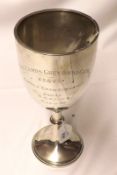 A George V Trophy Goblet of usual form, with spreading circular foot, knopped stem and cut-shaped