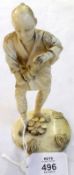 Oriental Ivory Okimono, modelled as a standing figure in robes, raised on a round plinth base