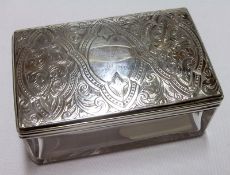 A Rectangular Cut Glass Toiletry Box with arabesque engraved lid, 3 ½” x 2 ¼”, London 1869, Maker