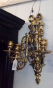 A Neo-Classical Style Three Branch Gilt Metal Wall Sconce with ribbon mounts, 15” high